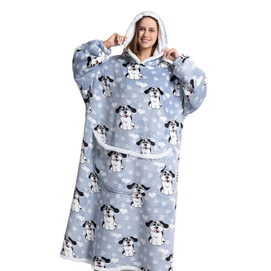 Smiling woman wearing a blue long snuggle hoodie with dog pattern. 